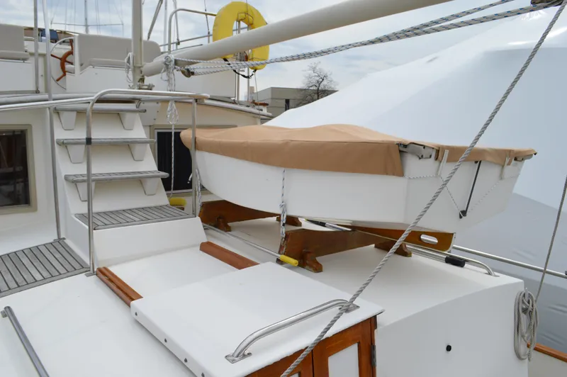Interlude Yacht Photos Pics 1987 Grand Banks 36 Classic yacht deck with covered dinghy and metal stairs.