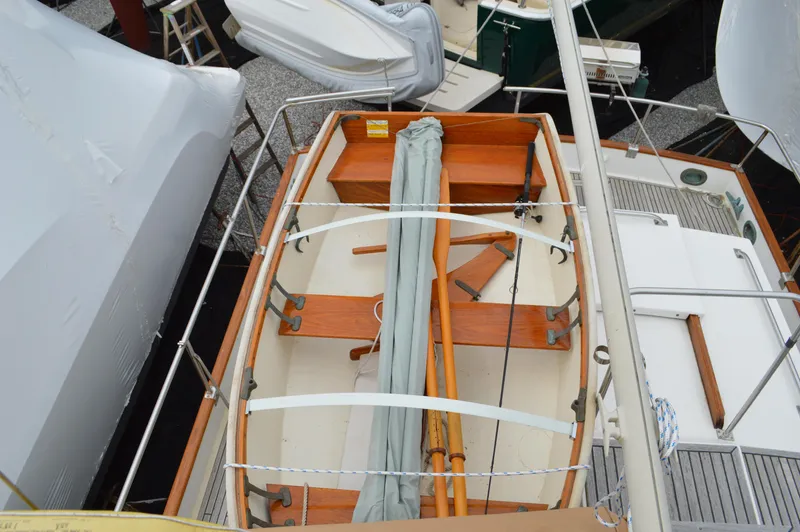 Interlude Yacht Photos Pics 1987 Grand Banks 36 Classic boat deck with wooden details and stored equipment.