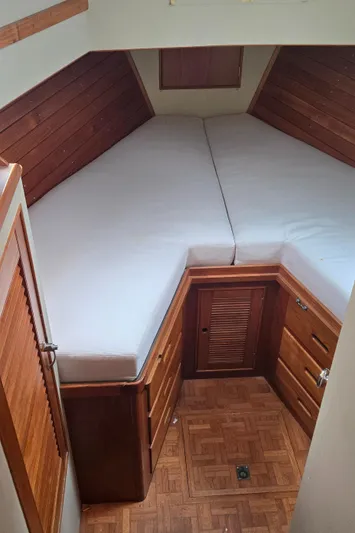 Interlude Yacht Photos Pics 1987 Grand Banks 36 Classic cabin with V-berth and wooden cabinetry.