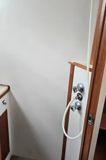 Interlude Yacht Photos Pics 1987 Grand Banks 36 Classic yacht interior shower area with wooden trim.