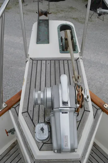 Interlude Yacht Photos Pics 1987 Grand Banks 36 Classic boat anchor winch on wooden deck.