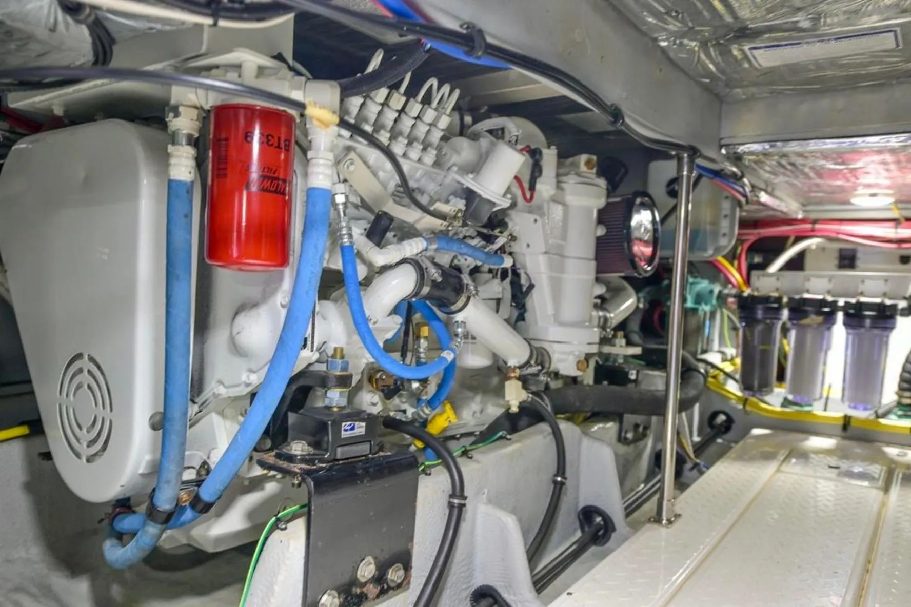 Engine room of 2004 Meridian 490 Pilothouse with visible machinery and components.