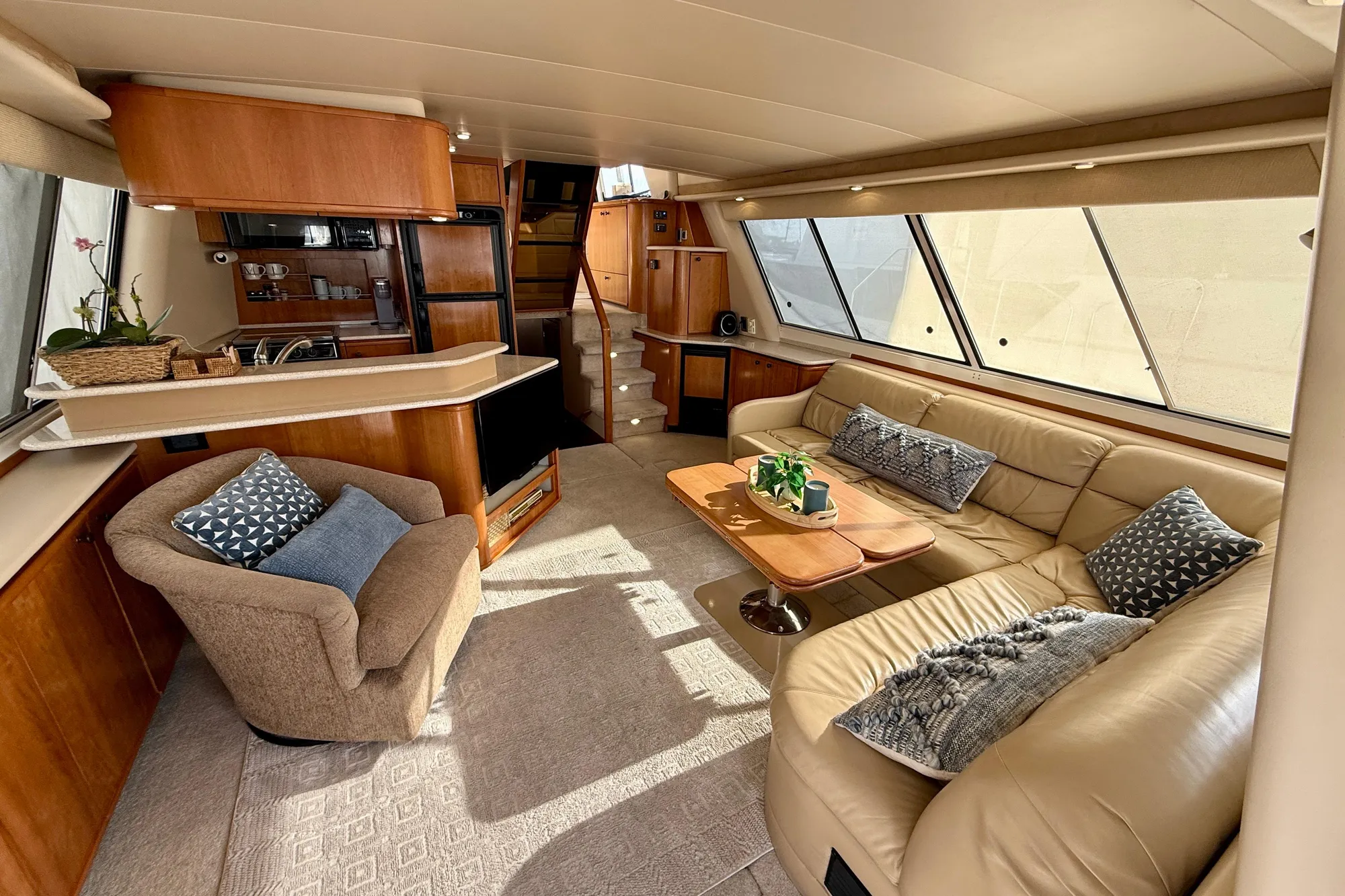 Luxurious interior of 2004 Meridian 490 Pilothouse yacht with elegant seating and modern amenities.