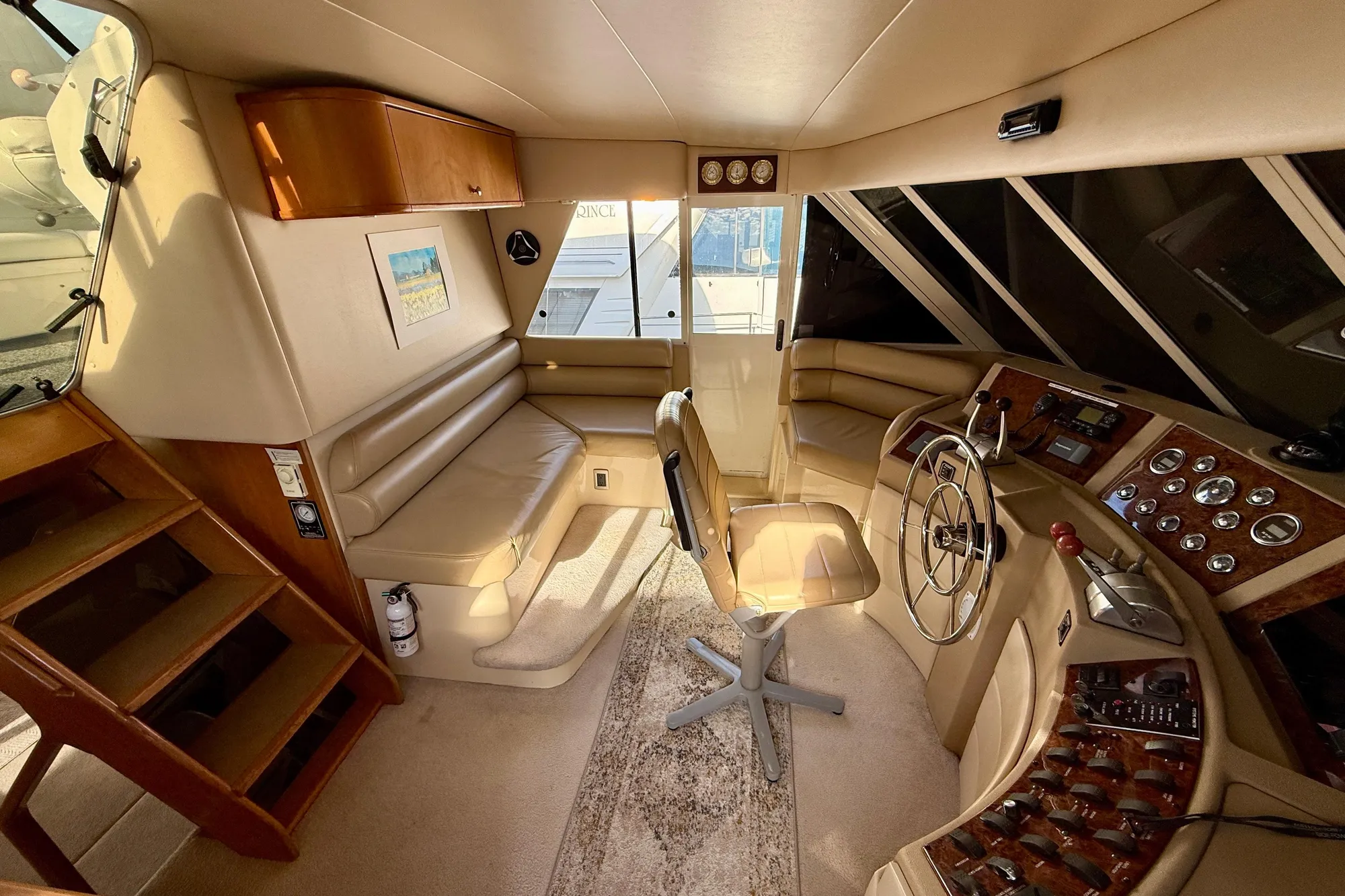 2004 Meridian 490 Pilothouse interior with helm, seating, and wooden accents.