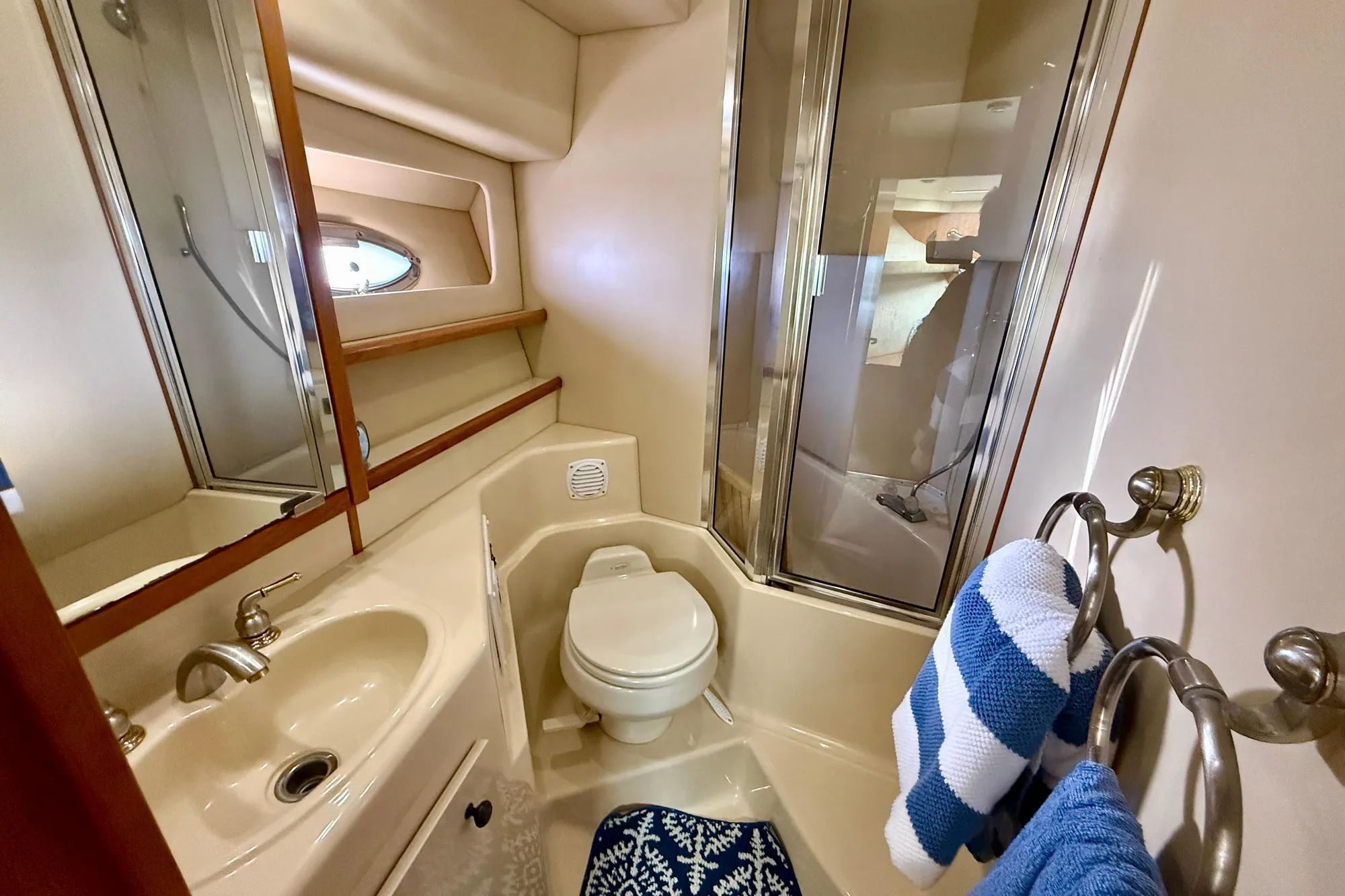 Bathroom interior of 2004 Meridian 490 Pilothouse yacht with shower and sink.