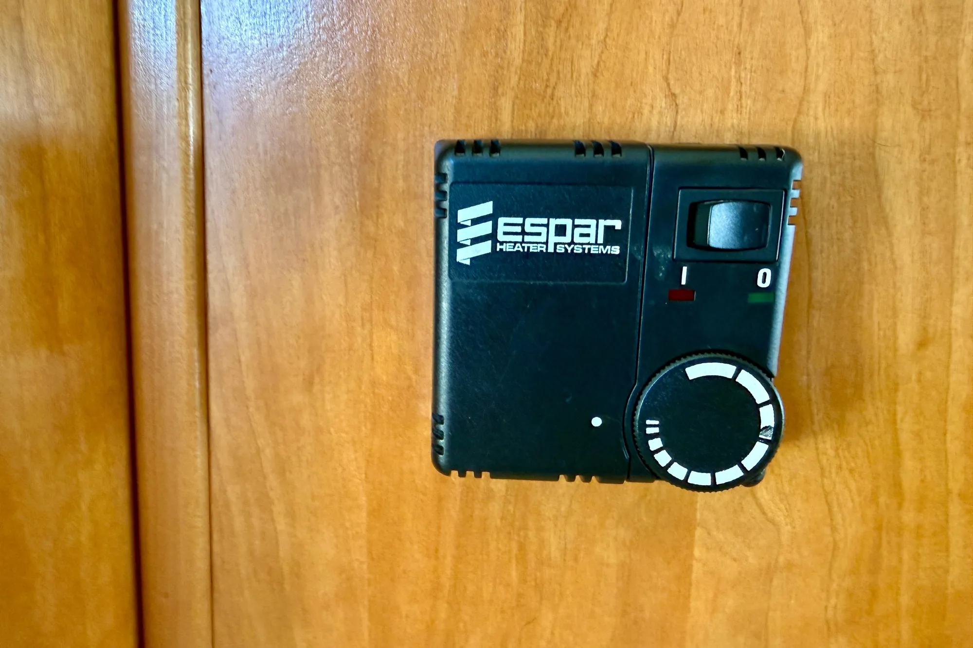 Espar heater control on 2004 Meridian 490 Pilothouse wooden panel.