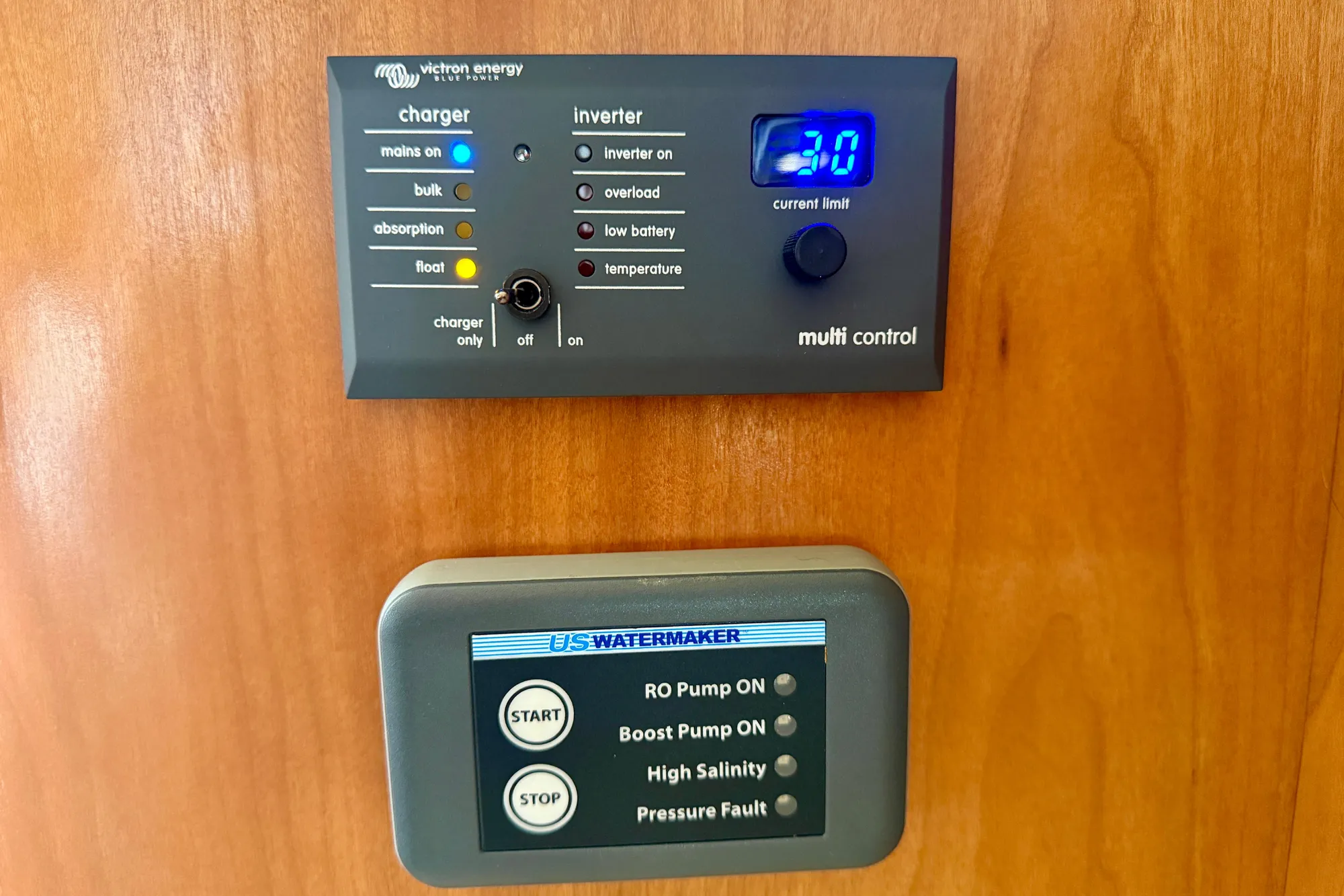 Control panels on a 2004 Meridian 490 Pilothouse boat, featuring Victron Energy charger and US Watermaker.