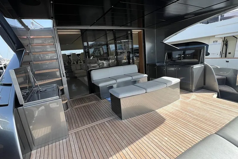 Honey Badger Yacht Photos Pics Luxurious 2012 Pershing 92 yacht deck with modern seating and sleek design.