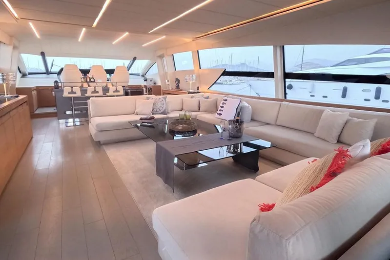 Honey Badger Yacht Photos Pics Luxurious interior of a 2012 Pershing 92 yacht with elegant seating and modern design.