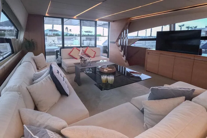 Honey Badger Yacht Photos Pics Luxurious interior of 2012 Pershing 92 yacht with modern seating and large windows.