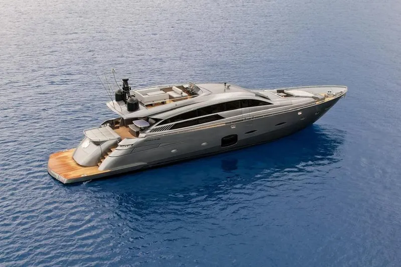 Honey Badger Yacht Photos Pics Luxurious 2012 Pershing 92 yacht cruising on calm blue waters.