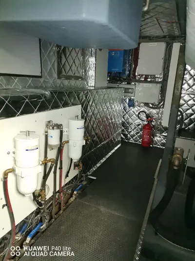 Panta Rei Yacht Photos Pics Engine room of 2022 Monachus 70 Fly yacht with equipment and fire extinguisher.