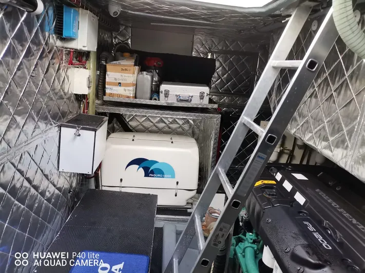 Panta Rei Yacht Photos Pics Engine room of 2022 Monachus 70 Fly yacht with equipment and ladder.