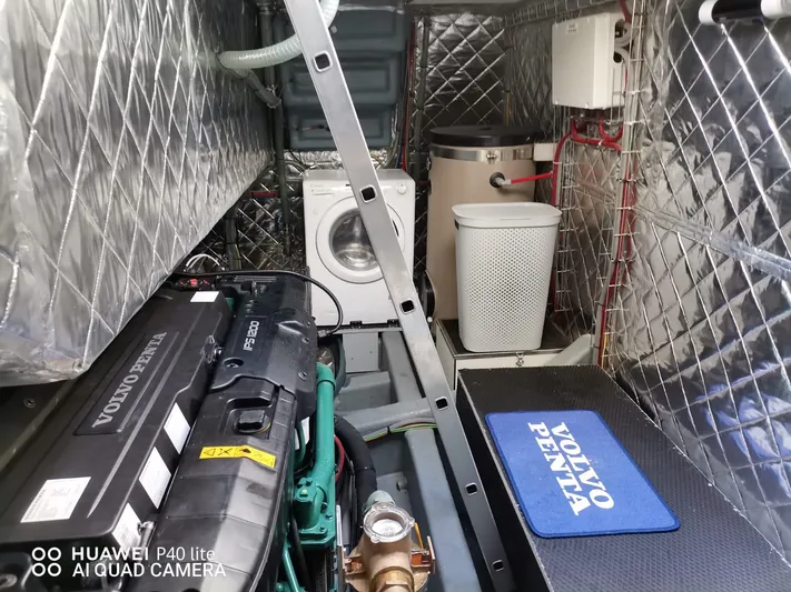 Panta Rei Yacht Photos Pics Engine room of 2022 Monachus 70 Fly yacht with Volvo Penta engine and washing machine.