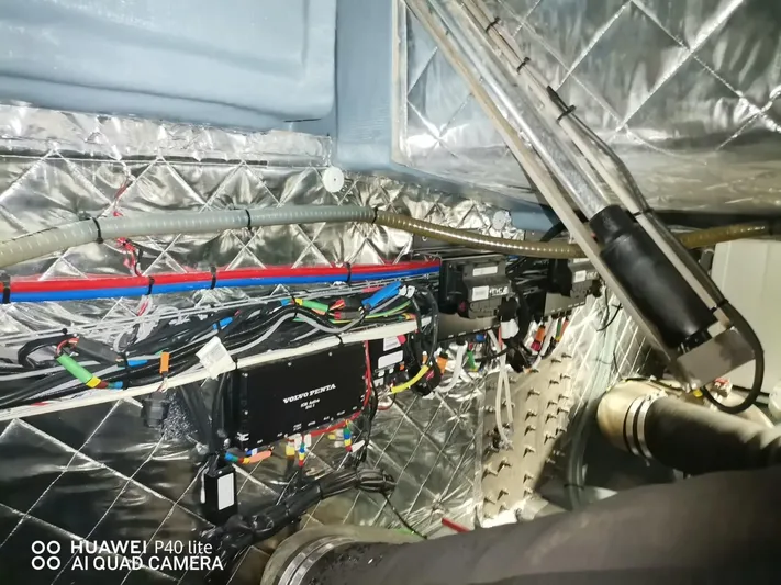 Panta Rei Yacht Photos Pics Engine room wiring of 2022 Monachus 70 Fly yacht, featuring insulated panels and organized cables.