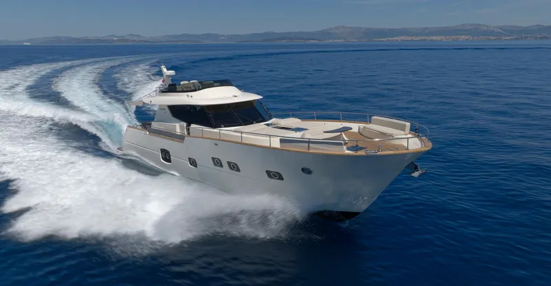 Panta Rei Yacht Photos Pics Luxury Monachus 70 Fly yacht cruising on open sea, 2022 model.