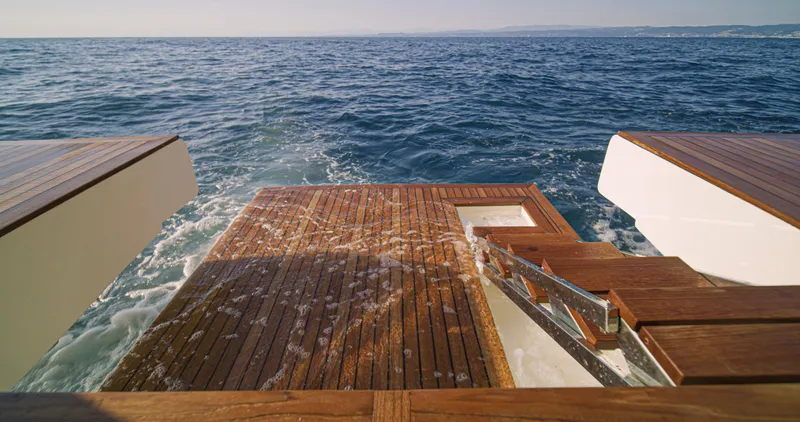 Panta Rei Yacht Photos Pics Monachus 70 Fly 2022 yacht deck with ocean view, featuring elegant wooden finish.