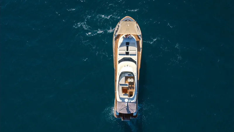 Panta Rei Yacht Photos Pics Aerial view of 2022 Monachus 70 Fly yacht cruising on open water.