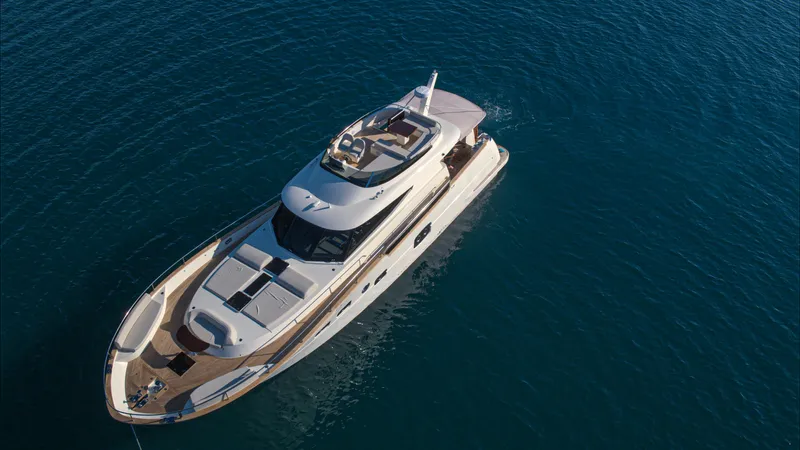 Panta Rei Yacht Photos Pics Luxury Monachus 70 Fly yacht, 2022 model, cruising on serene blue waters.