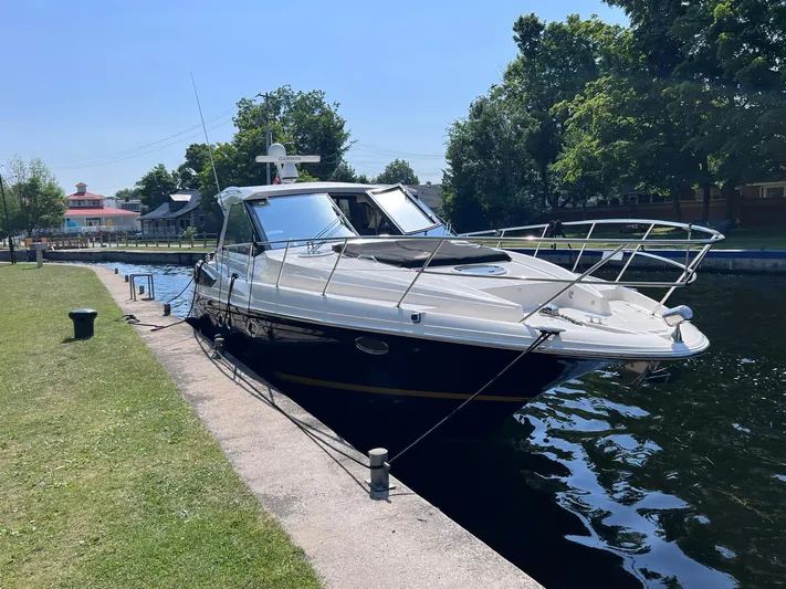 Rough Play Yacht Photos Pics 2010 Regal 600 Express yacht docked by a canal on a sunny day.