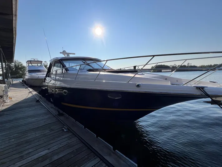 Rough Play Yacht Photos Pics 2010 Regal 600 Express yacht docked under bright sun.
