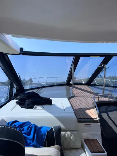 Rough Play Yacht Photos Pics Interior view of 2010 Regal 600 Express yacht with clear blue sky.