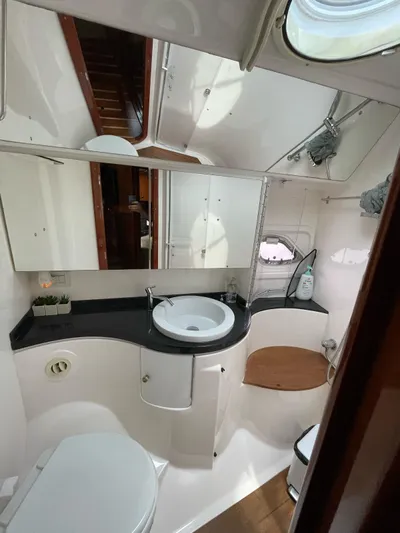 Rough Play Yacht Photos Pics 2010 Regal 600 Express bathroom with modern fixtures and compact design.