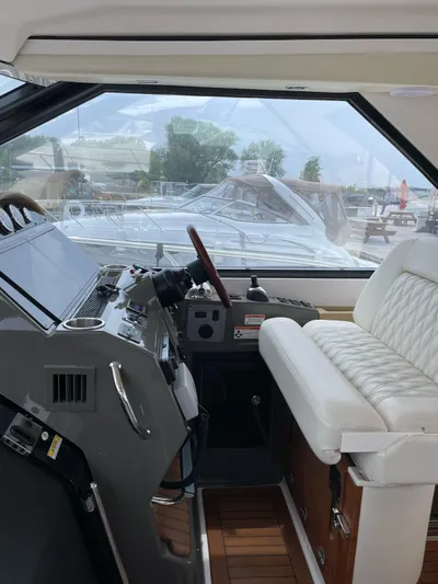 Rough Play Yacht Photos Pics 2010 Regal 600 Express yacht interior with helm and seating.