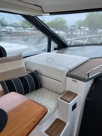 Rough Play Yacht Photos Pics 2010 Regal 600 Express yacht interior with plush seating and elegant wood accents.