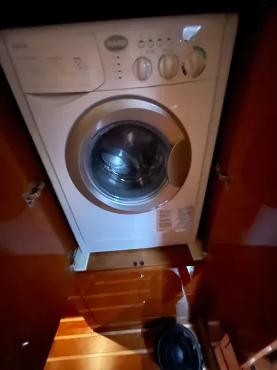 Rough Play Yacht Photos Pics Washing machine inside 2010 Regal 600 Express boat cabin.