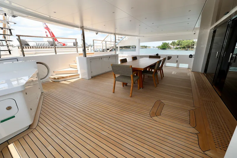  Yacht Photos Pics Luxurious deck of 2024 Rossinavi 49M Sport Yacht with elegant dining area.