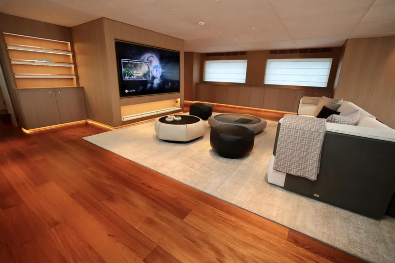  Yacht Photos Pics Luxurious interior of 2024 Rossinavi 49M Sport Yacht with modern furnishings and entertainment system.