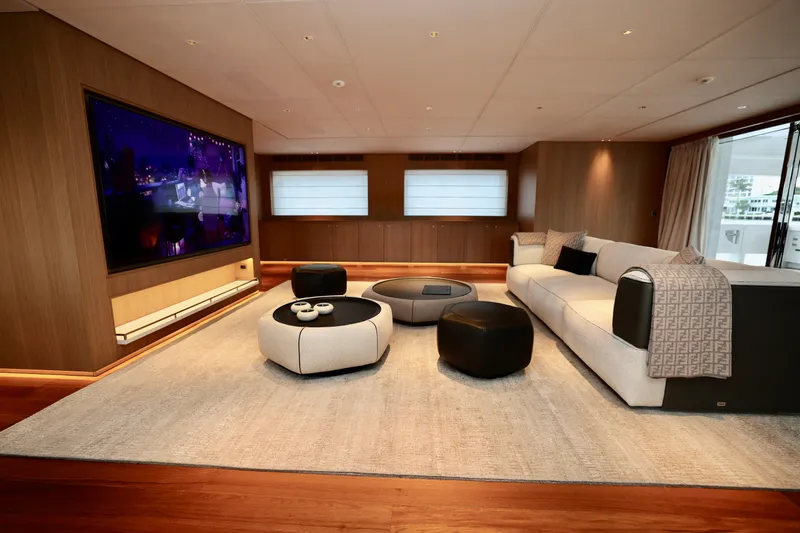 Yacht Photos Pics Luxurious interior of 2024 Rossinavi 49M Sport Yacht with modern decor and large TV.
