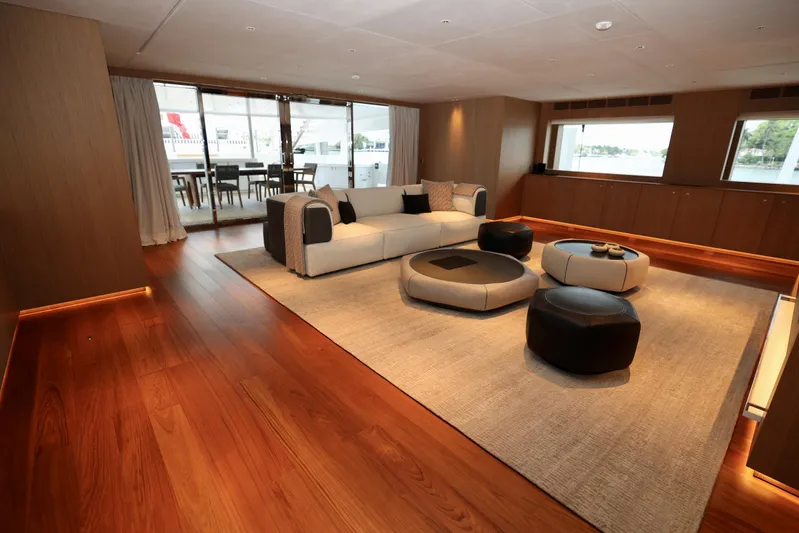  Yacht Photos Pics Luxurious interior of 2024 Rossinavi 49M Sport Yacht with modern furnishings and wooden flooring.