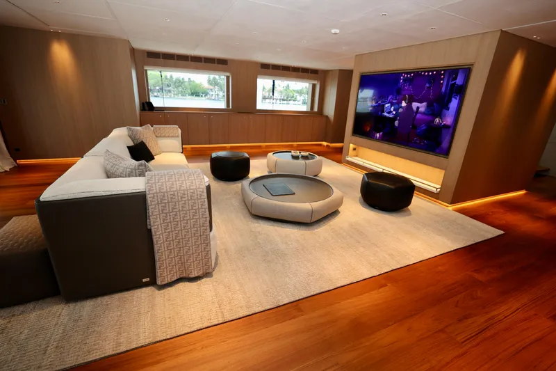  Yacht Photos Pics Luxurious interior of 2024 Rossinavi 49M Sport Yacht with modern seating and large TV.