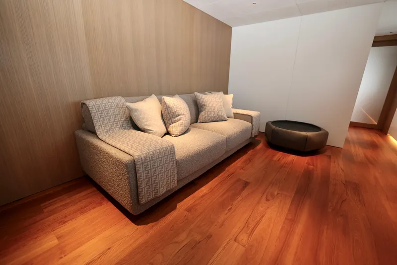  Yacht Photos Pics Luxurious interior of 2024 Rossinavi 49M Sport Yacht with elegant sofa and wooden flooring.