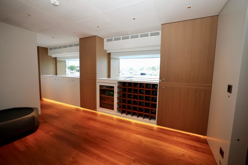  Yacht Photos Pics Luxurious interior of 2024 Rossinavi 49M Sport Yacht with elegant wood flooring and cabinetry.