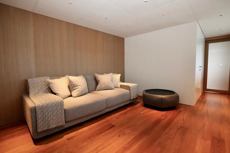  Yacht Photos Pics Luxurious interior of 2024 Rossinavi 49M Sport Yacht with modern sofa and wooden flooring.