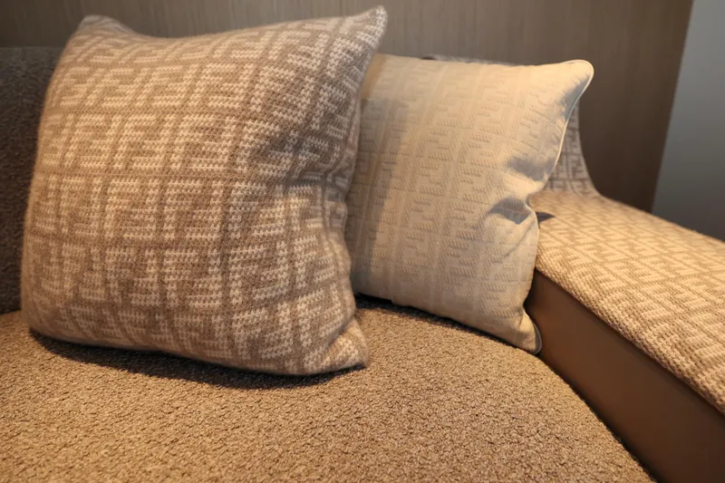  Yacht Photos Pics Luxurious cushions on Rossinavi 49M Sport Yacht 2024, featuring elegant beige patterns.