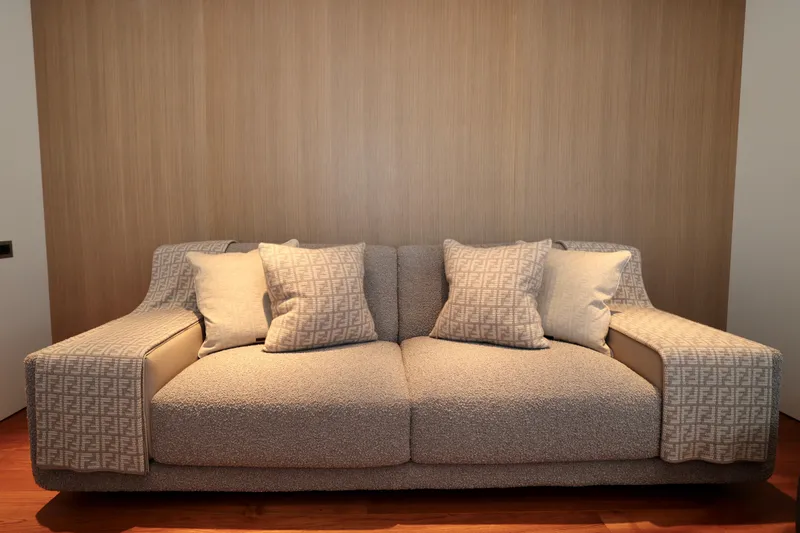  Yacht Photos Pics Luxurious beige sofa with patterned cushions on Rossinavi 49M Sport Yacht, 2024 model.