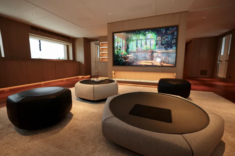  Yacht Photos Pics Luxurious interior of 2024 Rossinavi 49M Sport Yacht with modern seating and large screen.