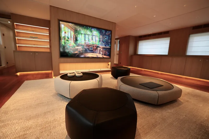  Yacht Photos Pics Luxurious interior of 2024 Rossinavi 49M Sport Yacht with modern seating and large screen.