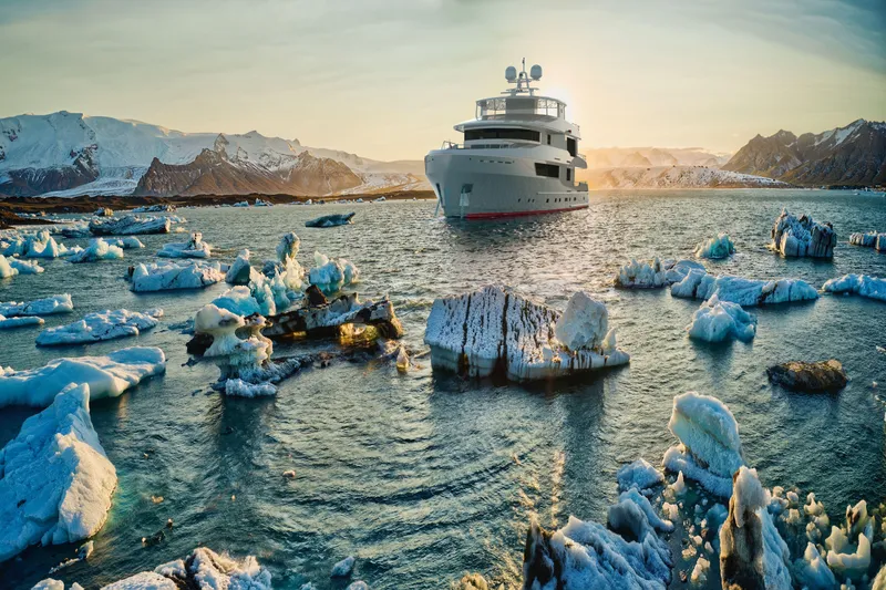 120 Discovery Yacht Photos Pics Luxurious 2027 Cheoy Lee 120 Discovery yacht navigating icy waters at sunset.