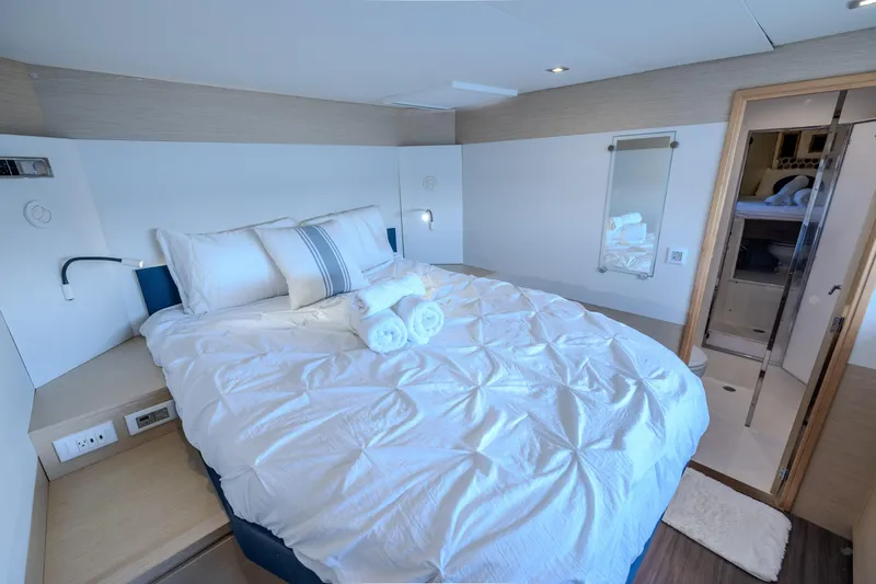  Yacht Photos Pics Luxurious bedroom interior of 2017 Fountaine Pajot Ipanema 58 yacht with cozy bedding.
