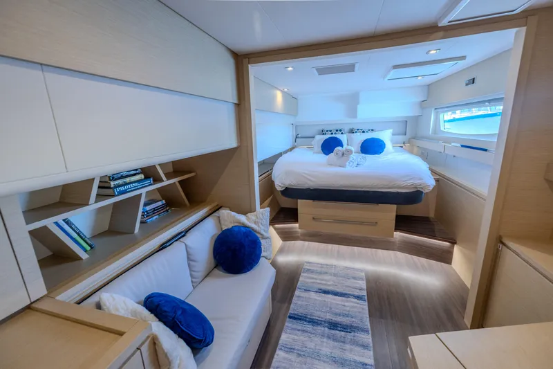  Yacht Photos Pics Luxurious interior of 2017 Fountaine Pajot Ipanema 58 yacht with cozy bedroom and seating area.