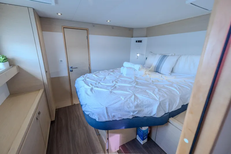  Yacht Photos Pics Luxurious bedroom interior of 2017 Fountaine Pajot Ipanema 58 catamaran with cozy bedding.
