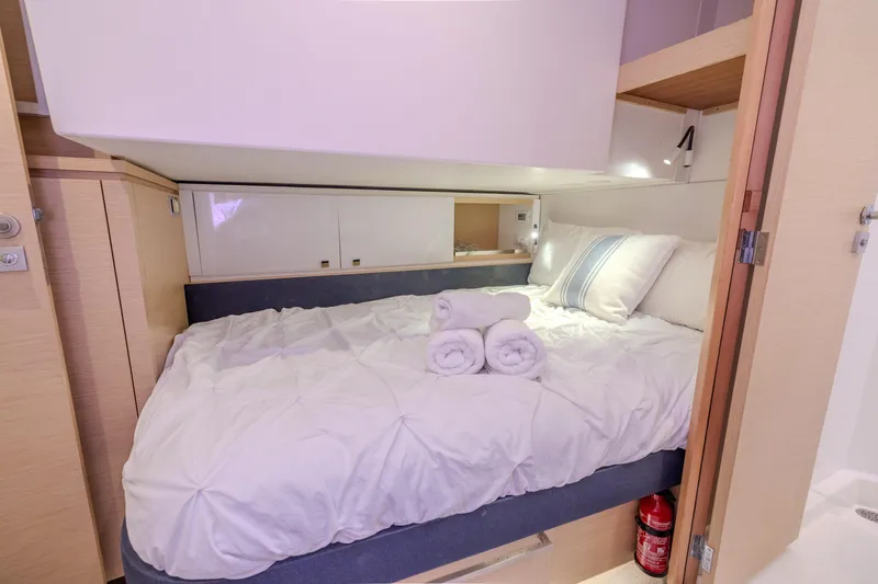  Yacht Photos Pics Luxurious cabin interior of 2017 Fountaine Pajot Ipanema 58 catamaran with cozy bedding.