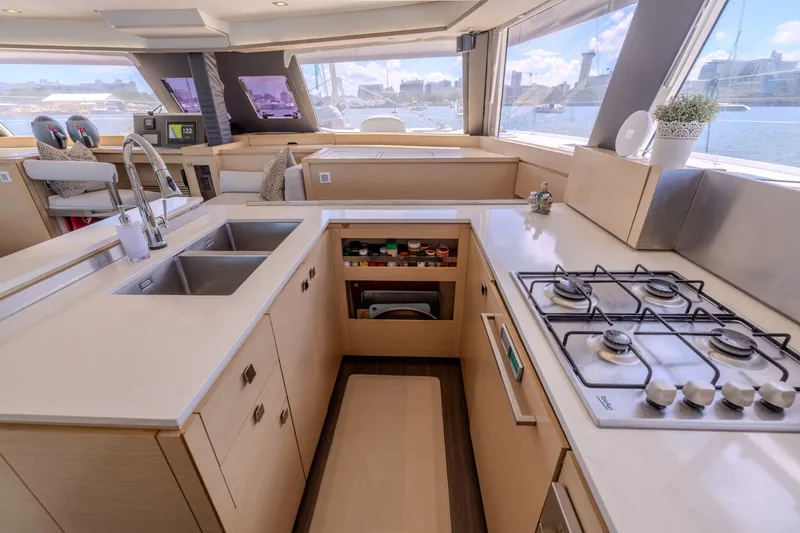  Yacht Photos Pics Luxurious 2017 Fountaine Pajot Ipanema 58 yacht kitchen with modern amenities and scenic views.
