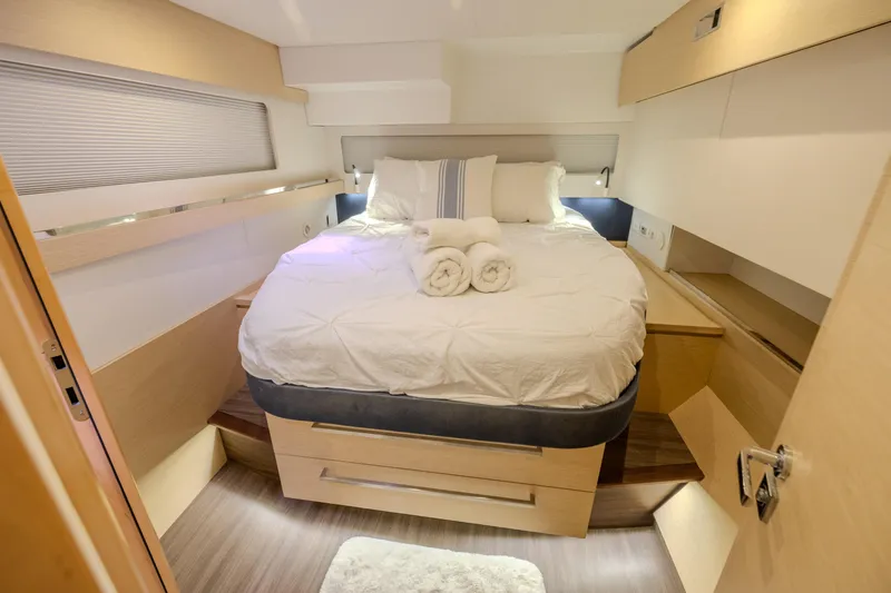  Yacht Photos Pics Luxurious bedroom interior of 2017 Fountaine Pajot Ipanema 58 yacht with cozy bedding.
