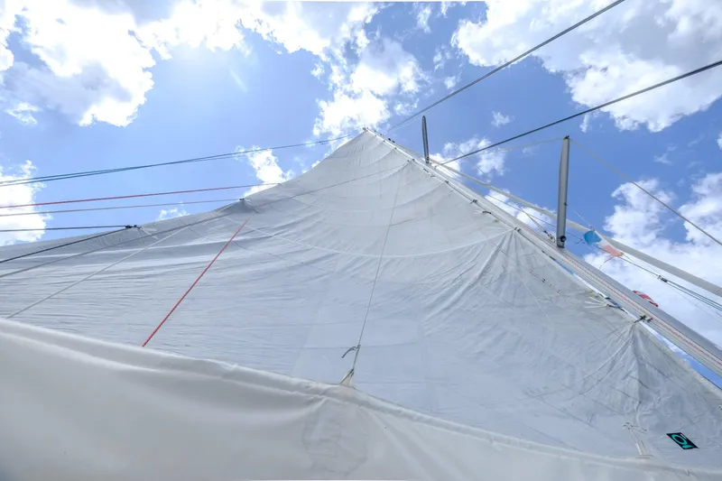  Yacht Photos Pics Sail of 2017 Fountaine Pajot Ipanema 58 catamaran against a bright blue sky.